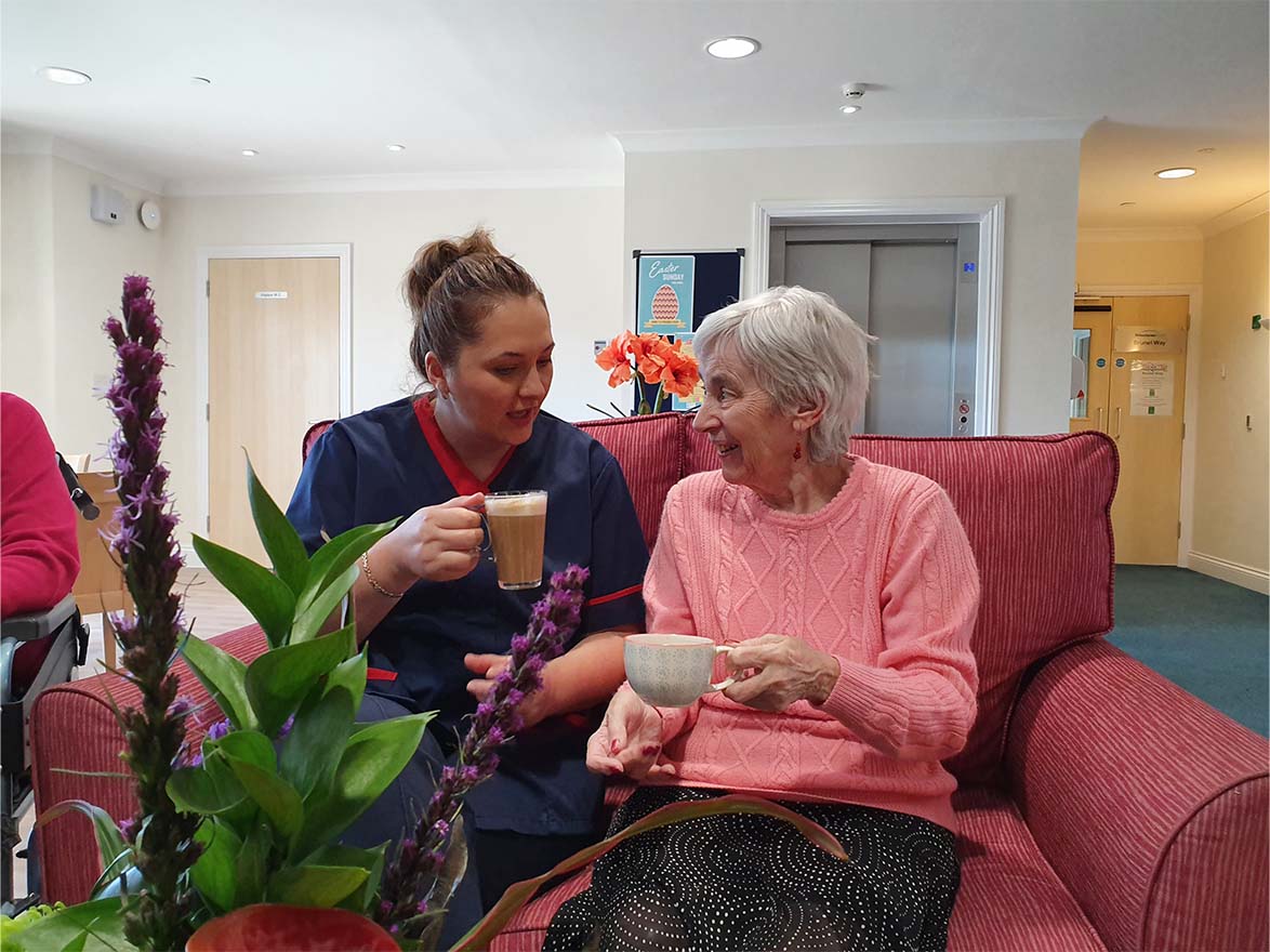 Resident and Staff With Tea