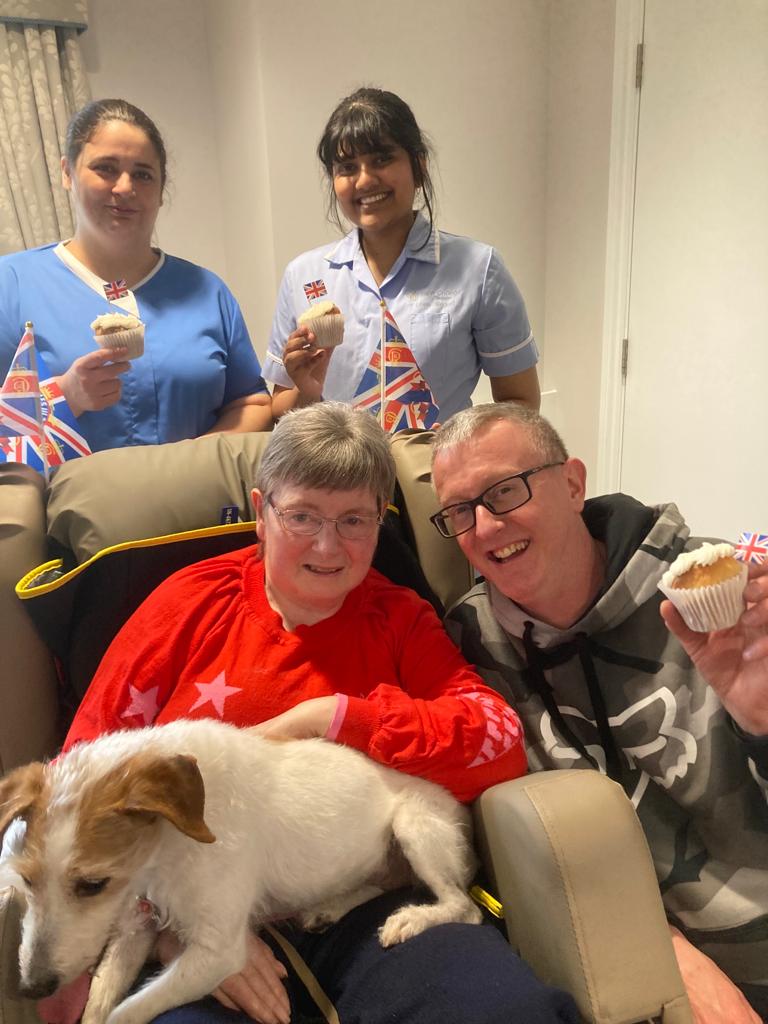 Our residents and a dog celebrating the Kings Coronation at Ridgeway Rise Care Home