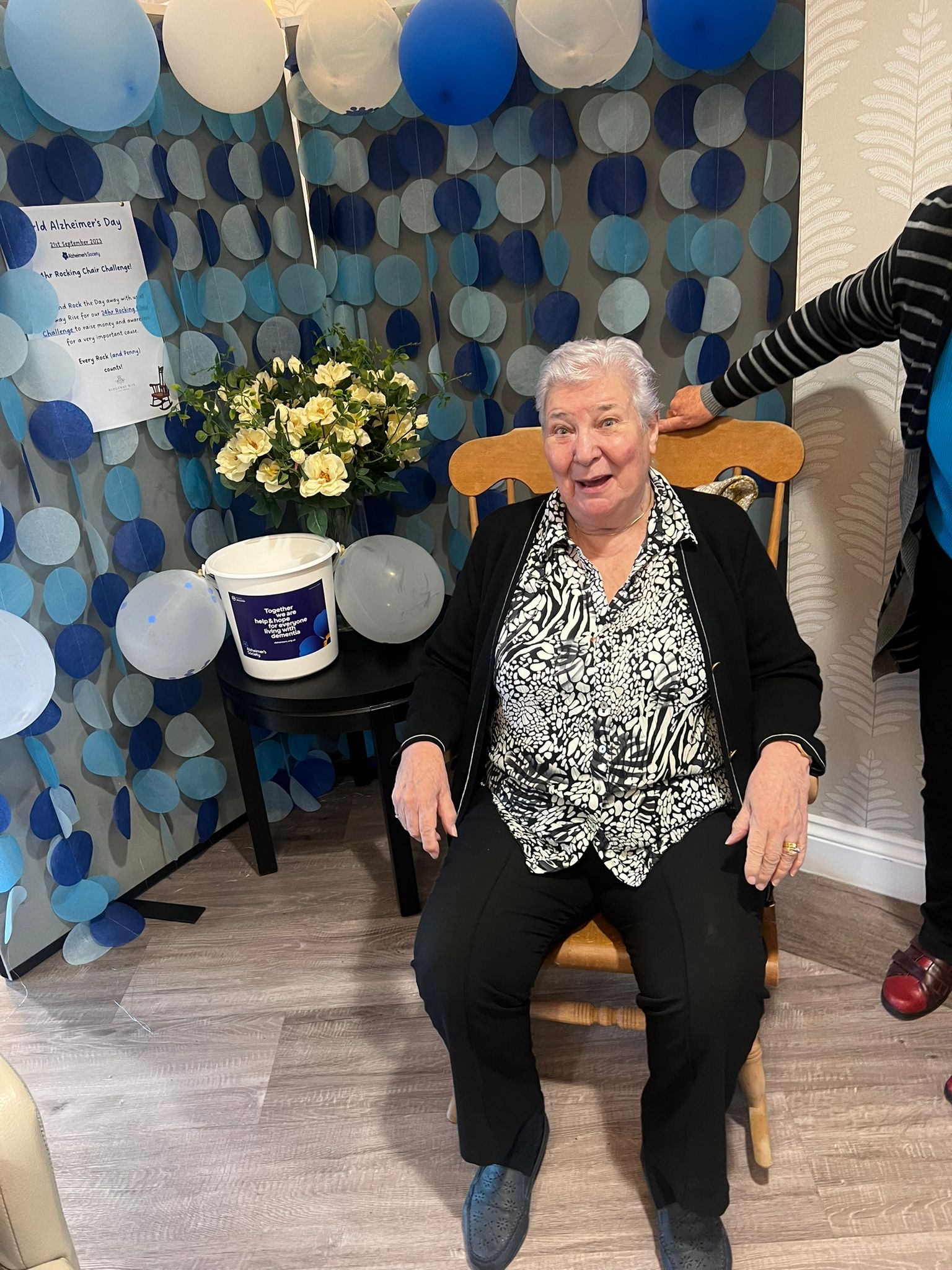 A resident sitting during a fund raiser for Alzheimer's Society
