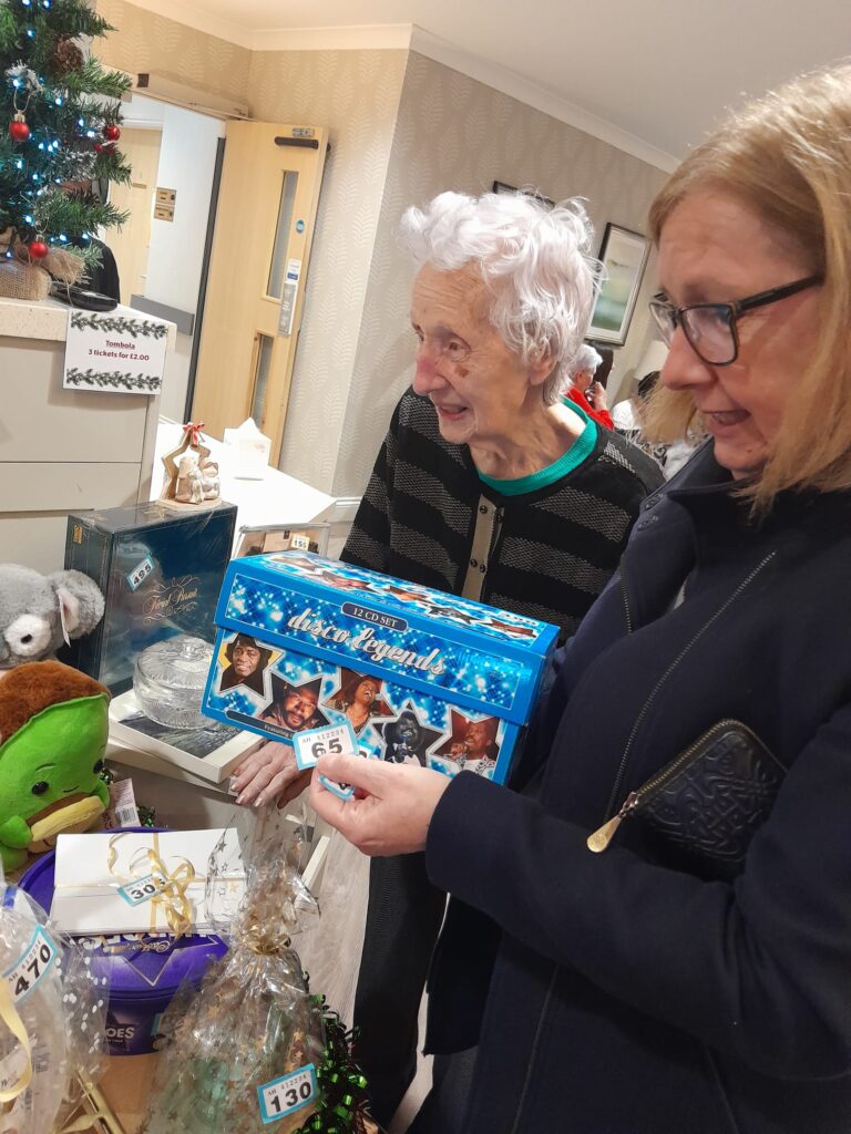 residents looking at presents