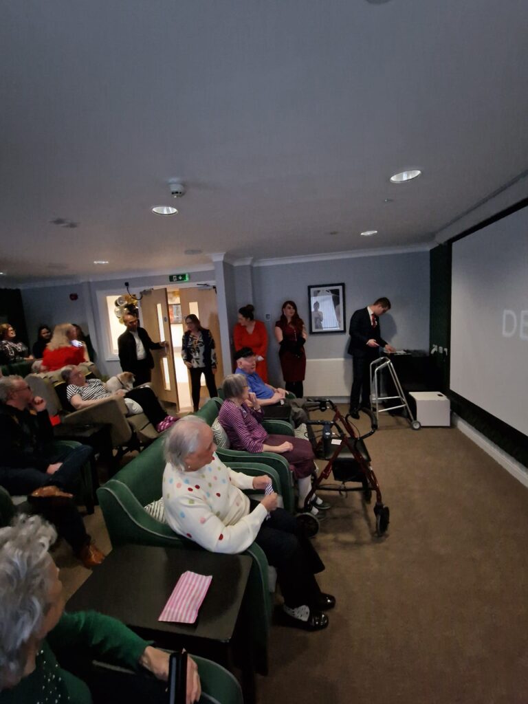 residents watching a film in the cinema room