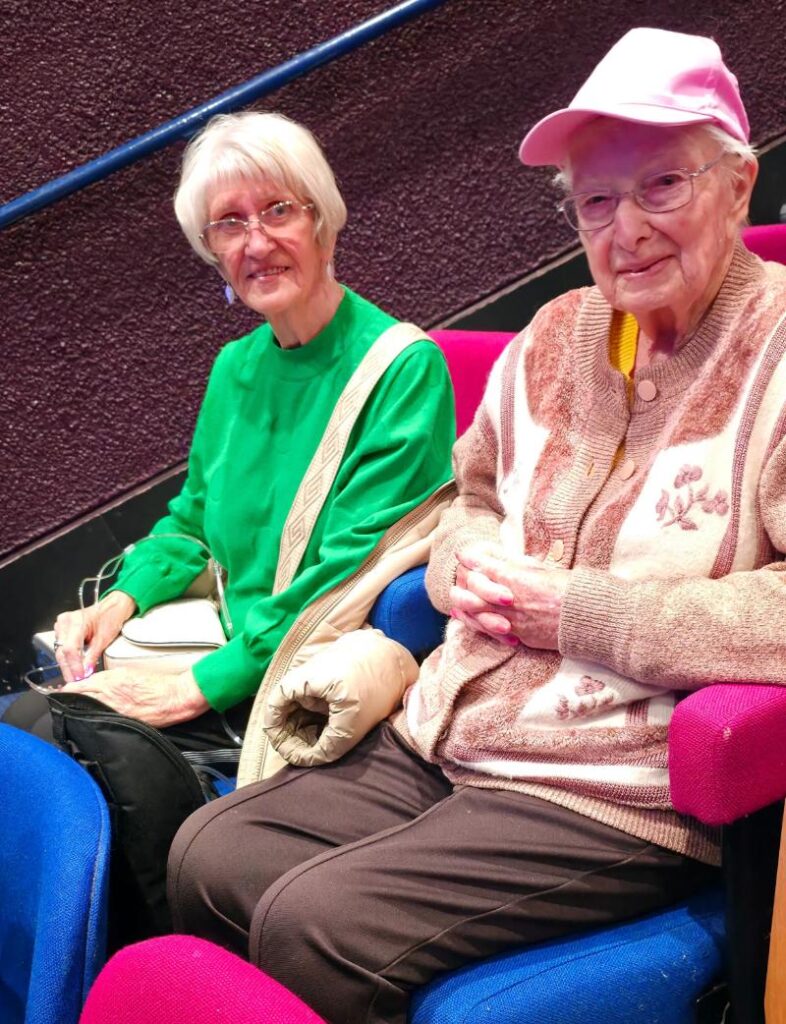 residents smiling in their theatre chairs