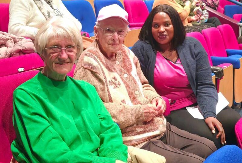 two of our female residents sat at the wyvern theatre with a member of our team