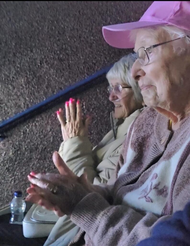 two of our residents watching a show at the wyvern theatre