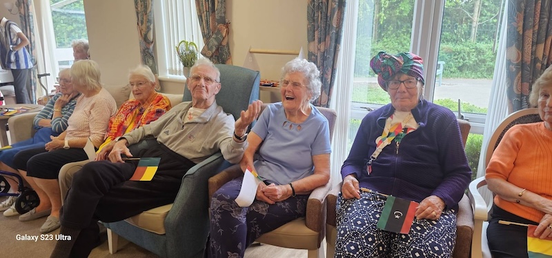residents enjoying performances for african culture day