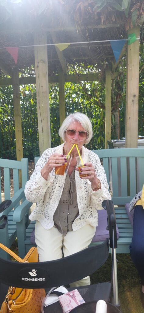 resident drinking 2 cups of pimms
