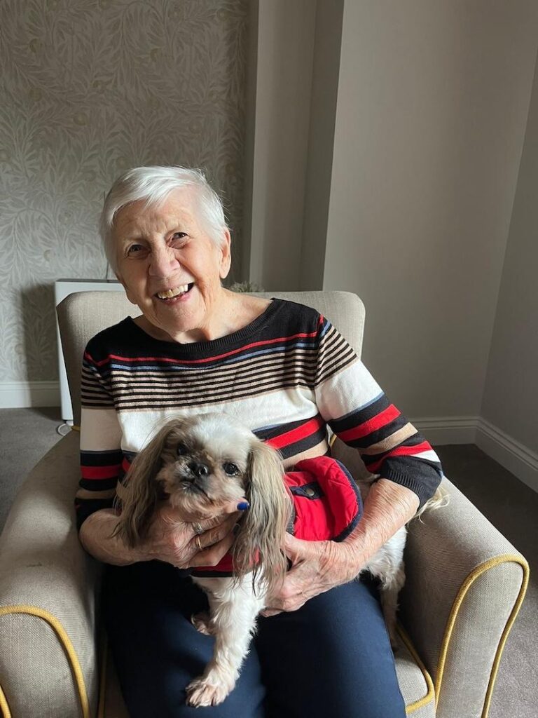 one of our residents with a therapy dog