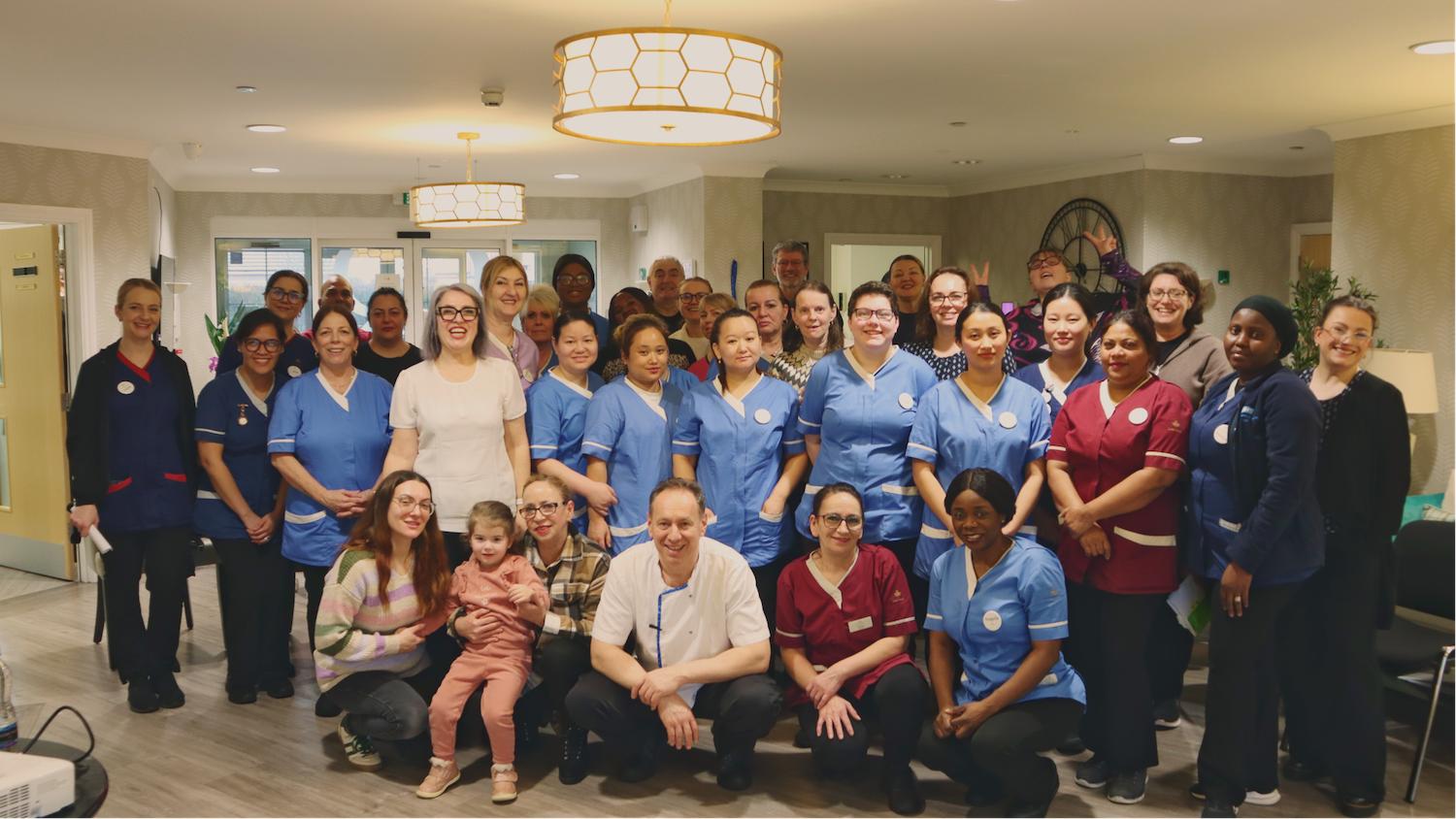 a group of team members at Ridgeway rise having a photo taken for achieving a top 20 care home award