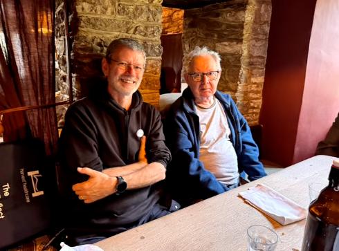 two men sat at a table