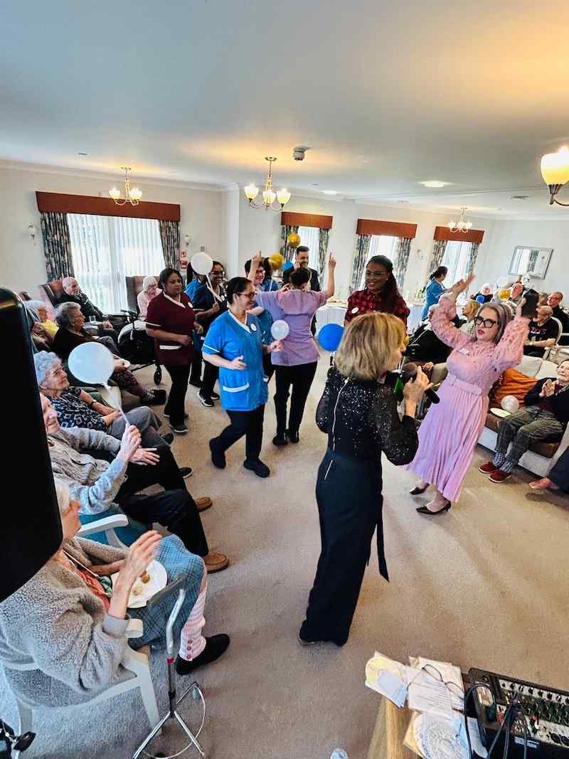 our team stood in the lounge dancing