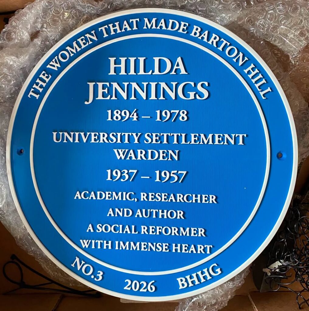 a blue plaque with the name hilda jennings
