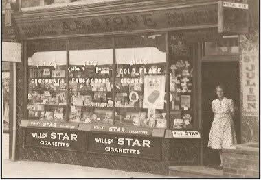 an old black and white photo of a shop
